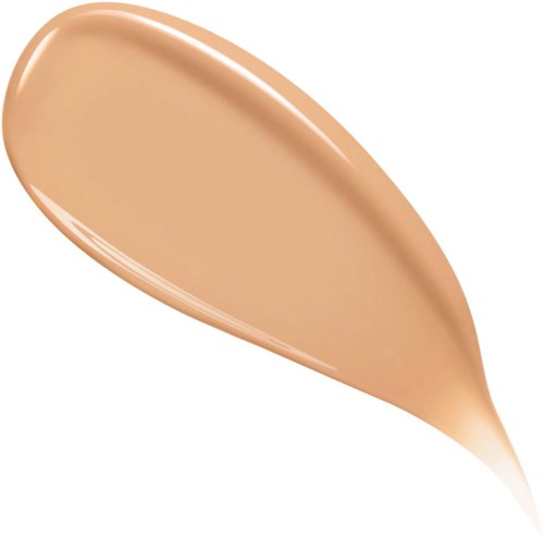 A drop of beige-colored liquid on a white background.