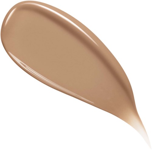 A beige-colored makeup foundation swatch with a glossy finish, shaped like a teardrop or leaf.