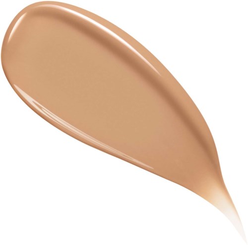 En beige væskeliknende makeup, som foundation eller concealer, på hvit bakgrunn.