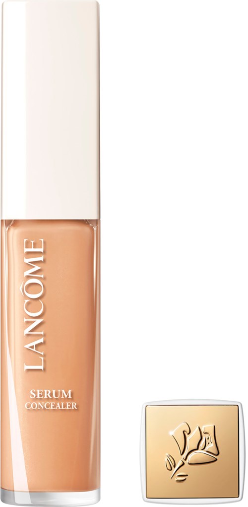 Lancôme serum concealer bottle with a gold lid and white box behind it.