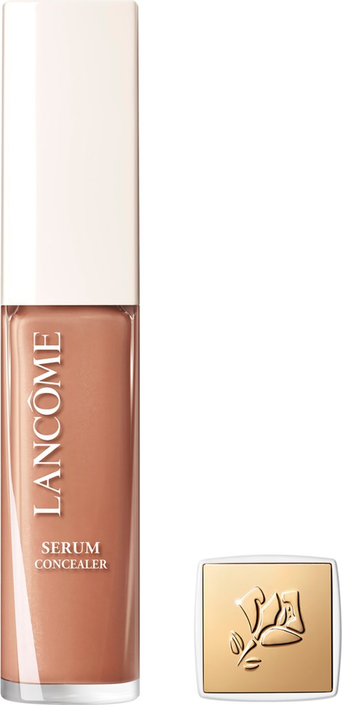 A Lancôme serum concealer in a tall, clear bottle with a white cap and a gold square logo.