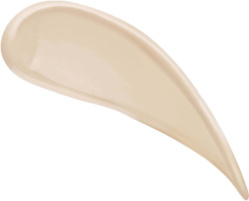 En beige, tåreformet klat af creme eller lotion på hvid baggrund.