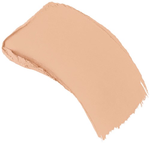 Ett beige sminkborststreck eller smet med oregelbundna kanter. Det ser ut som ansiktsd ofta eller foundation.