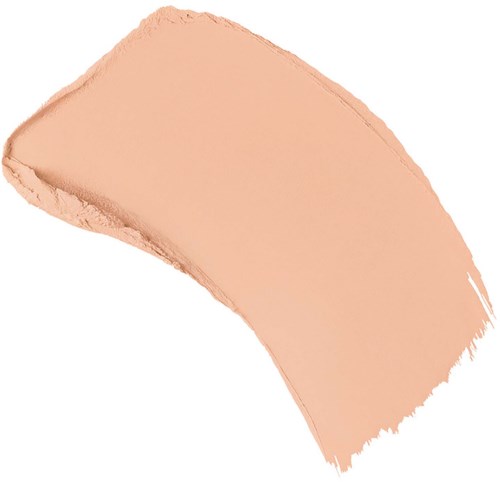 En beige makeupconcealer i en kurvig form mot en vit bakgrund.
