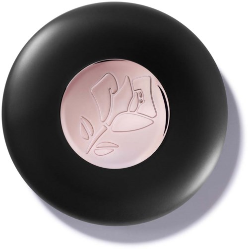 A black circular container holds light pink makeup cream with a rose embossed design. The container has a lip-shaped logo.