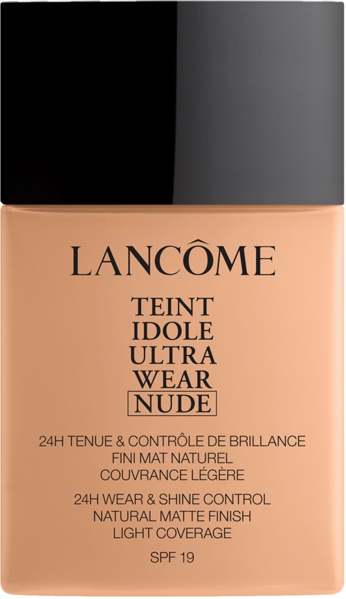 A bottle of Lancôme Teint Idole Ultra Wear Nude foundation with a black cap and beige liquid inside.