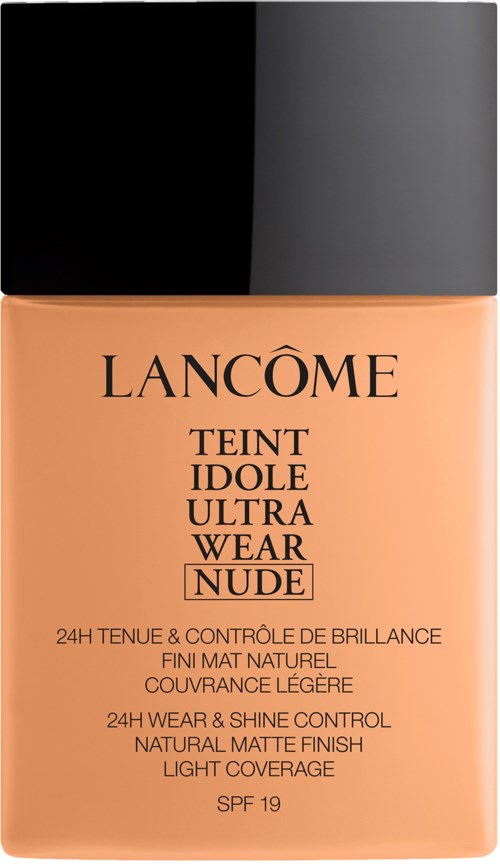 A foundation bottle with black cap, beige liquid, and text describing product specifics and sun protection factor.