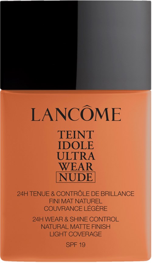 A bottle of Lancôme Teint Idole Ultra Wear Nude foundation with black and gray cap and orange label.