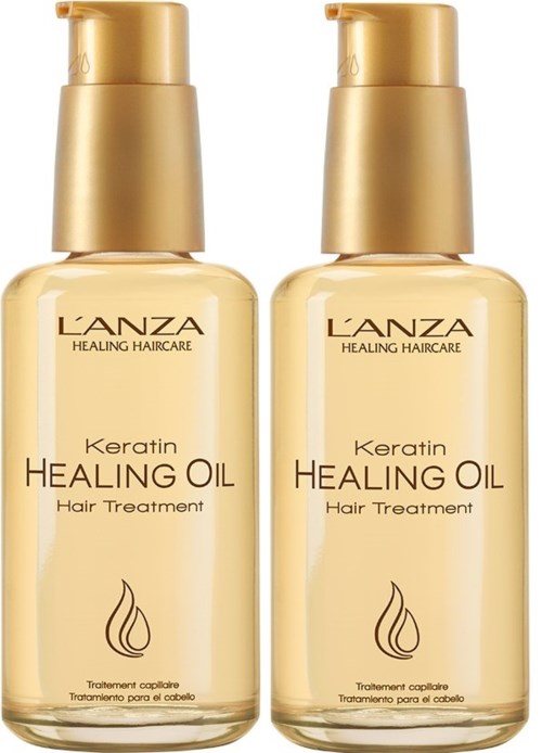 To flasker med Lanza Keratin Healing Oil for hårpleie med gullropper.