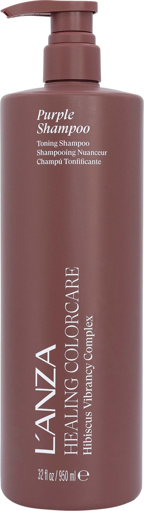 En lång, brun schampoflaska med pump, märkt Purple Shampoo och L'ANZA Healing Colour.