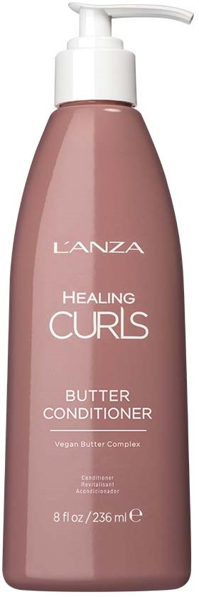 En rosa flaska med pump märkt L'ANZA Healing Curls Butter Conditioner, 8 fl oz. Den är för lockigt hår.