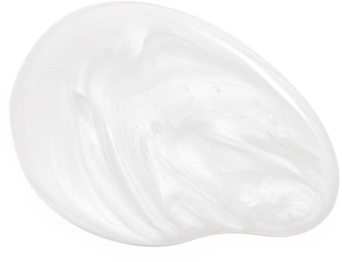 A white cream or lotion spread on a dark surface, with a smooth and shiny texture.