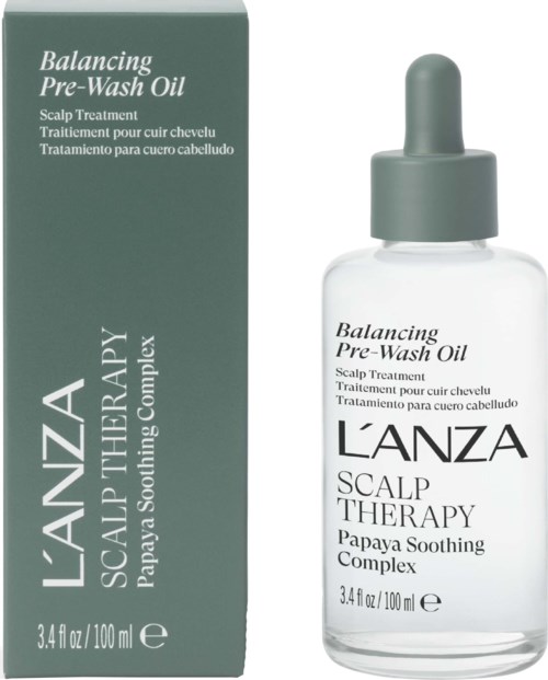 En klar glasflaska med droppare medel innehållande Balancing Pre-Wash Oil för skalpslappande behandling, märkt av L'ANZA.