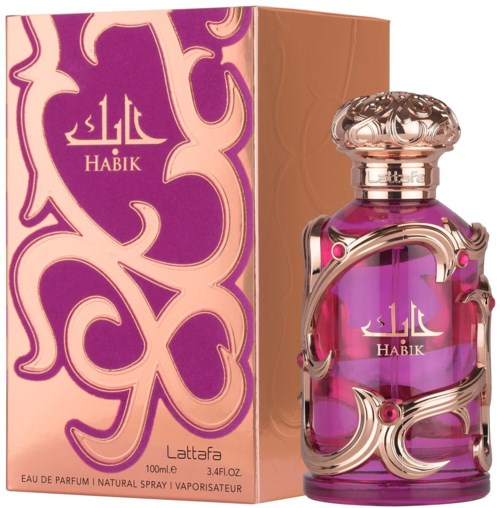 A colorful perfume bottle decorated with silver swirls and pink accents, alongside a matching pink and brown box.