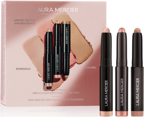 Laura Mercier rajoitettu erikoispakkauksen mini-highlighter-kynttilät Rosegold, Caramel ja Golden Peach vaaleanpunaisessa pakkauksessa.