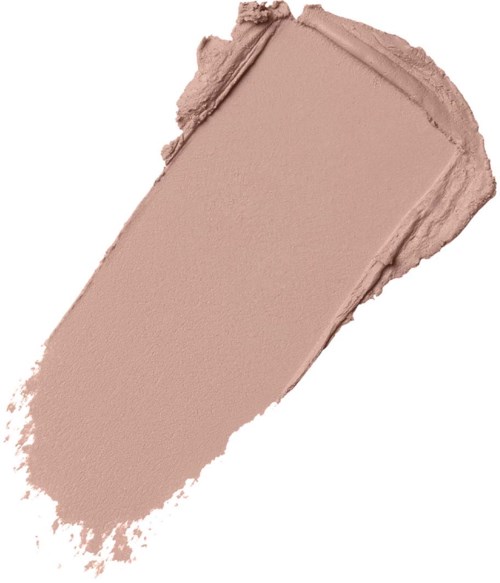 Ett tunt lager av ljusbeige pulver, troligen makeup eller ansiktspuder, med ojämn yta och mjuk yta.