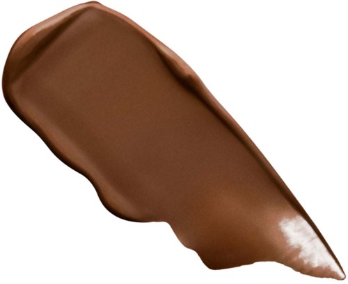 A brown creamy substance, shaped like a brush stroke, appears smooth and shiny.