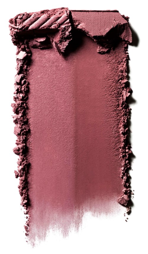 Rosa makeuppuder med några trasiga bitar ovanför och en mjuk gradient som breder ut sig nedåt.