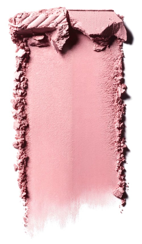 Ett rosa sminkrouge som är trasigt med några trasiga bitar runtomkring.