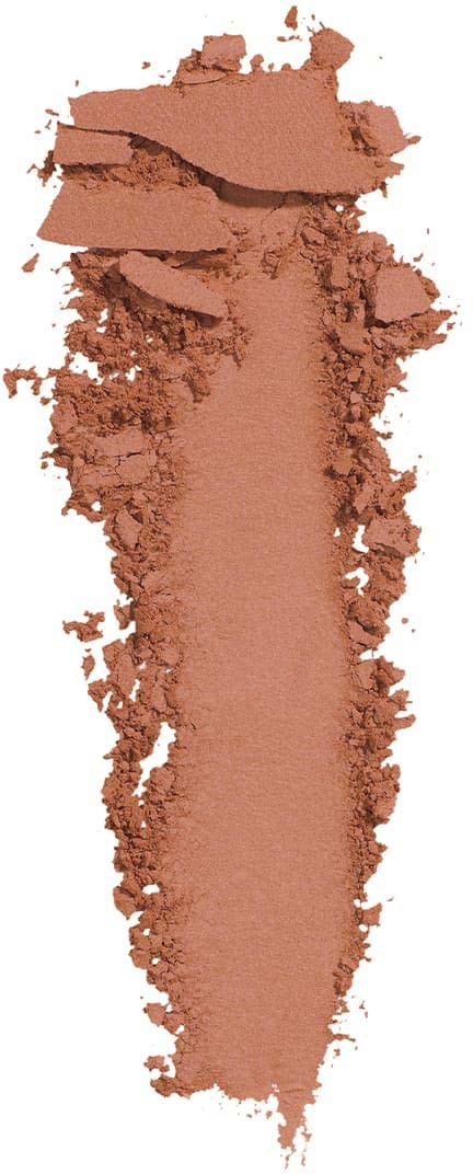 A crushed brown powder, resembling makeup or pigment, forms a vertical streak with some uneven edges.