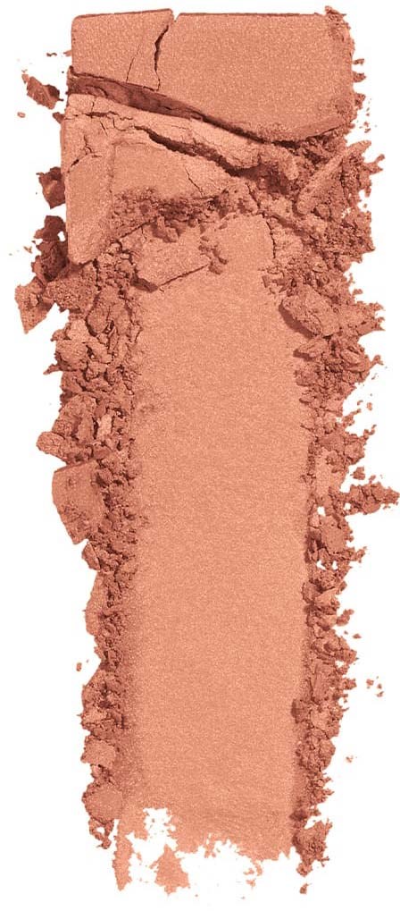 A crushed peach or coral-colored powder spreads out in a vertical streak with large chunks at the top.