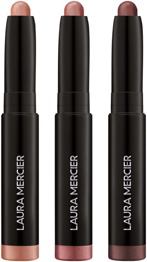 Tre läppstift i olika nyanser, svart förpackning, med varumärket Laura Mercier. De står upprätt.