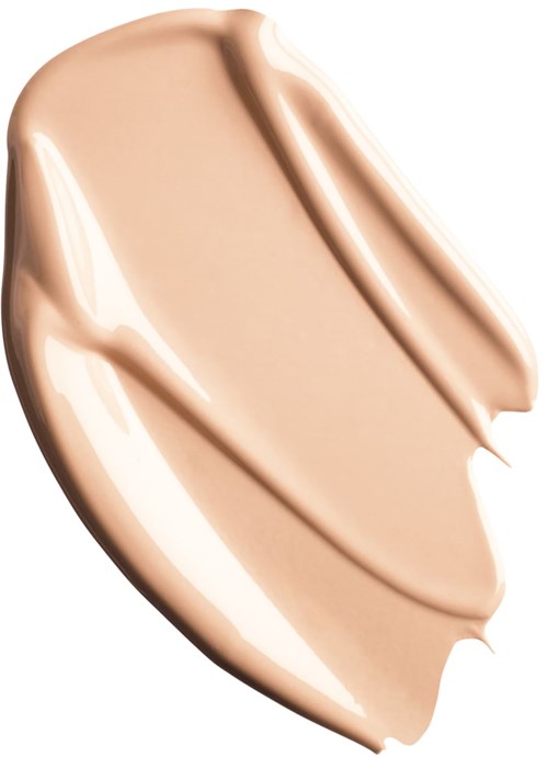 En beige eller ljusbrun krämig substans som är utbredd med tre drag, visar en slät och glansig textur.