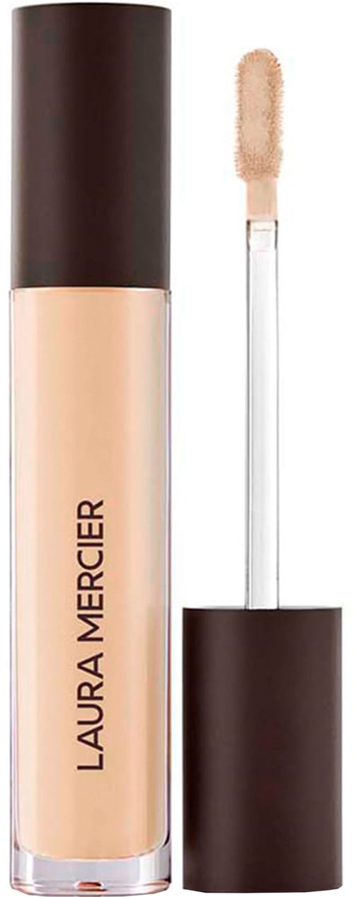 Flytande concealer i rör med applikator och svart lock. Laura Mercier-varumärket på röret.
