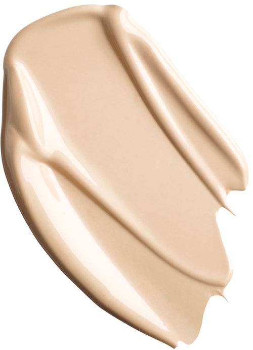 En beige kräm med slät textur, spridd i ett böjt och flytande mönster.