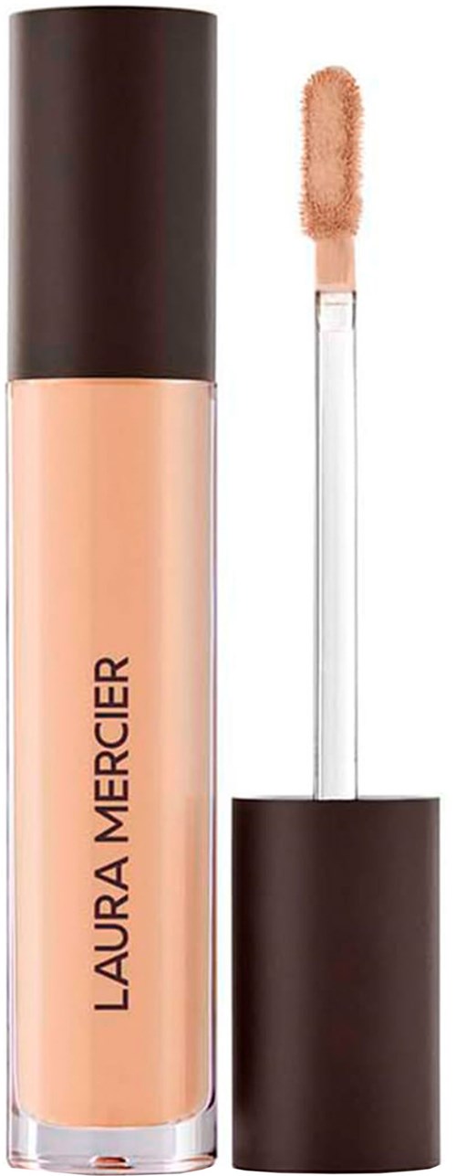 Läppstift med svart och beige tube, samt penselapplicator med persikofärgad produkt.