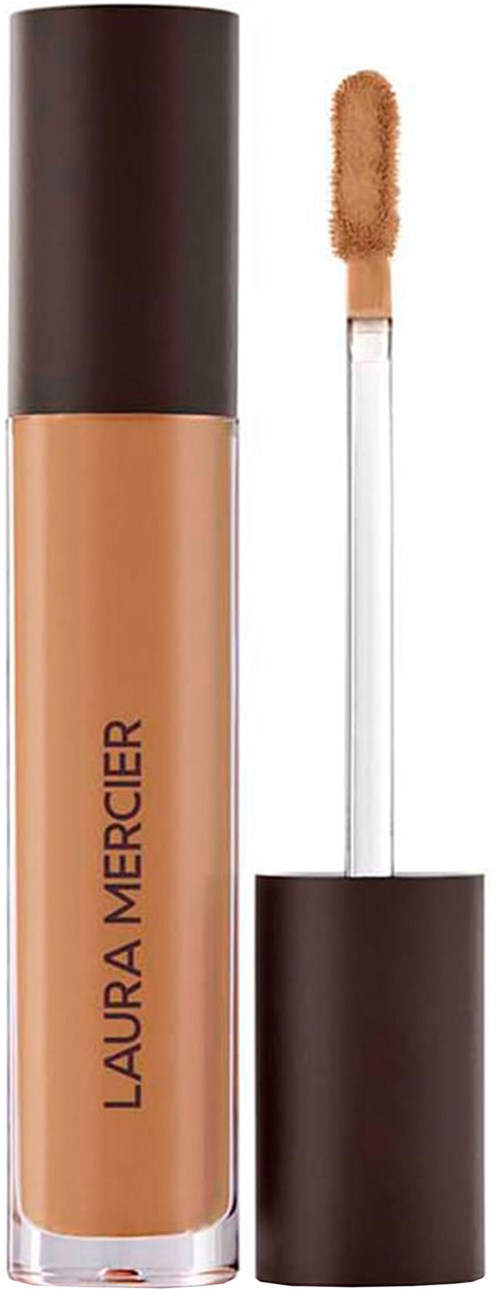 En makeup-blekningsrör med applikator, märkt Laura Mercier, i beige färg.