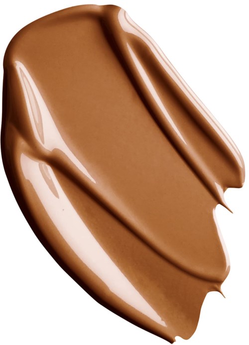 En slät smet av brunt krämigt ämne, troligen choklad eller liknande, med glansig yta och kurviga kanter.