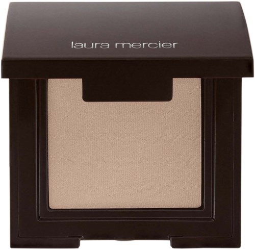 A makeup compact with beige powder inside, black case, and 'laura mercier' written on the lid.