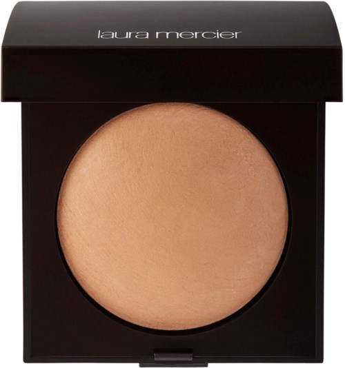 A compact powder case with Laura Mercier branding, containing a beige pressed powder for makeup application.
