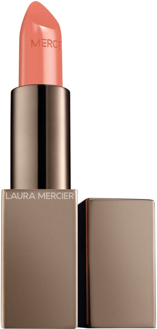 A peach-colored lipstick in a sleek silver case with a beige outer cover and the brand name Laura Mercier.