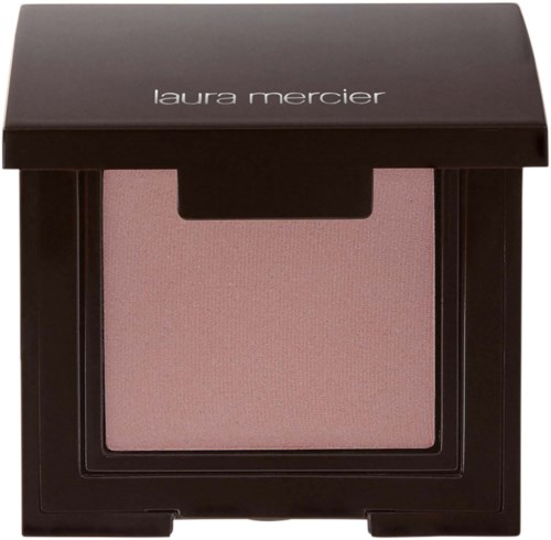 Ein Rouge-Container in schwarzer Schachtel mit rosa Rouge darin, beschriftet 'laura mercier'.