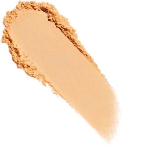 Ein beiger Pulver in einer Halbkugel mit dunklem Rand, wahrscheinlich ein Kosmetik- oder Make-up-Produkt.