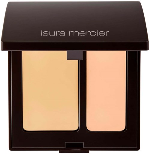A Laura Mercier makeup compact with two powder shades, one lighter yellow and the other peach.
