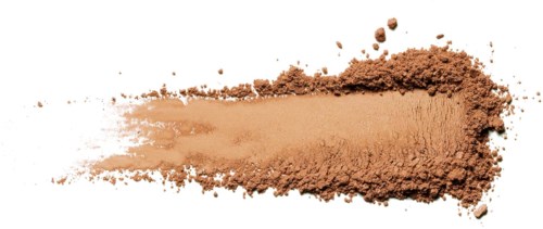 A streak of beige powder, likely makeup or ground substance, on white background, with scattered particles around.