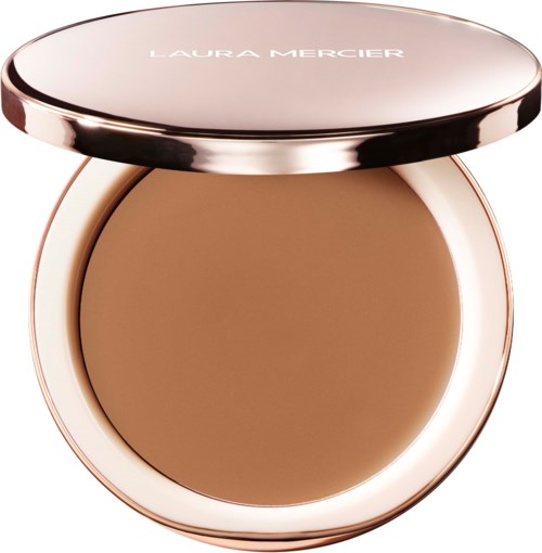 Ein Kompakt mit hellbraunem Puder und glänzendem roségoldenem Gehäuse. Laura Mercier geschrieben auf dem Deckel.