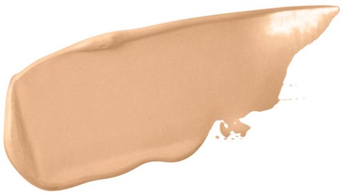 Ett streck av beige sminkkräm med en slät, krämig konsistens på en svart bakgrund.