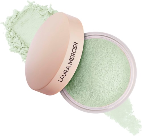 Et pastelfarvet rundt Laura Mercier løs pudderbeholder med lidt pudder spredt ved siden af.