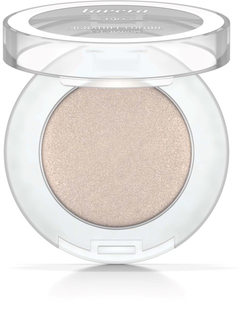 En rund, klar makeup-kompakt med ett beige puder inuti och ett genomskinligt lock.