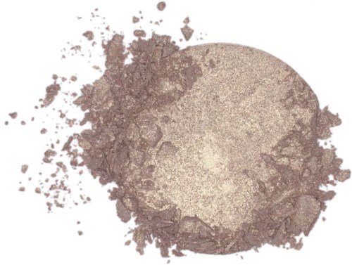 A beige powder, some of it crushed, spread out unevenly on a white background.