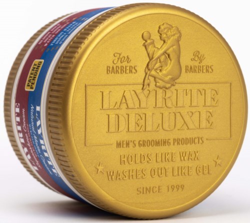 A yellow container with a woman and a ball on it, labeled for men's grooming products since 1999.