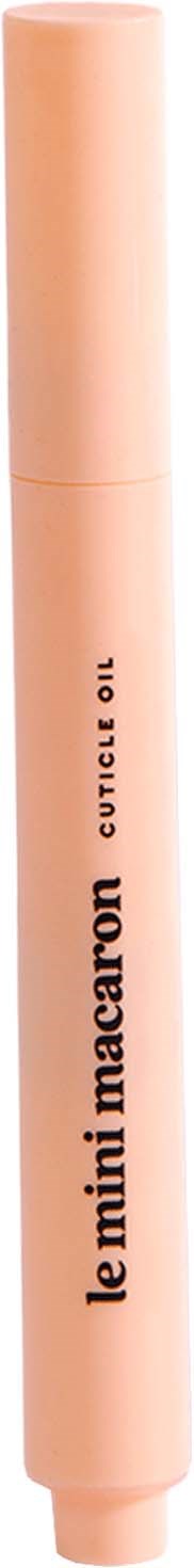 A peach-colored tube of Le Mini Macaron cuticule oil with a cap.