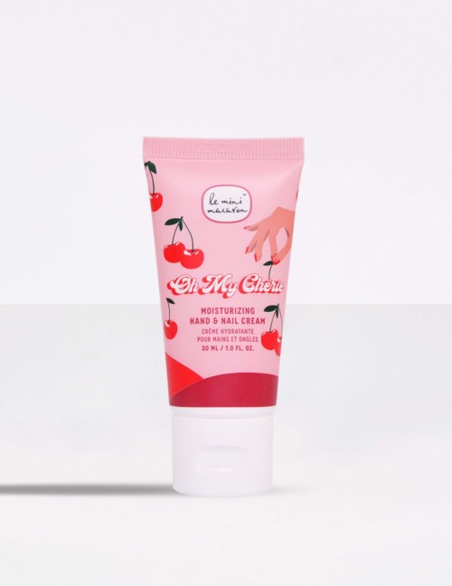 A pink tube of cherry-scented hand and nail cream with a cherry illustration and a hand reaching for cherries.