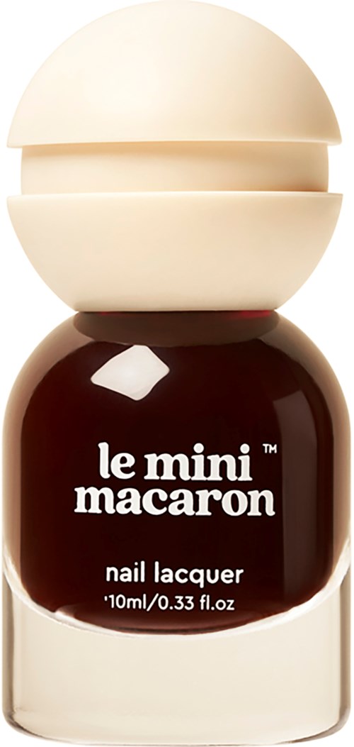 Small nail polish bottle with a black and white label that says "le mini macaroni."