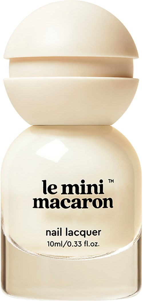 A small white nail polish bottle labeled "le mini macaroon" with a rounded top and simple design.