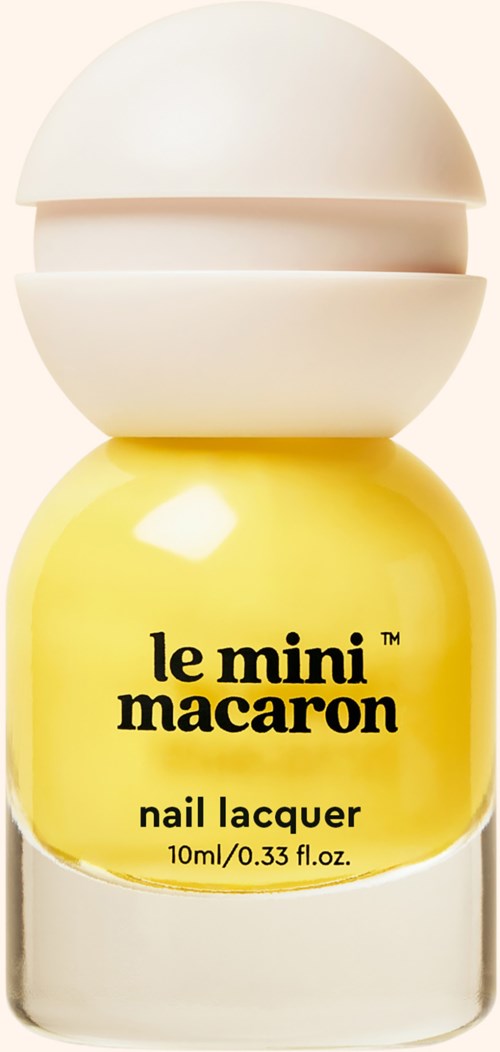 Yellow nail polish bottle with black text and a white cap. Brand is 'le mini macaron.'